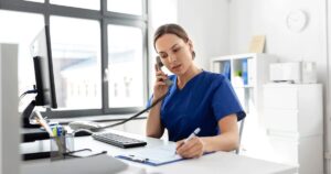Healthcare professional providing follow-up care over the phone after an abortion.