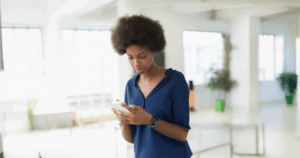 Woman checking pregnancy test results after missing her period.